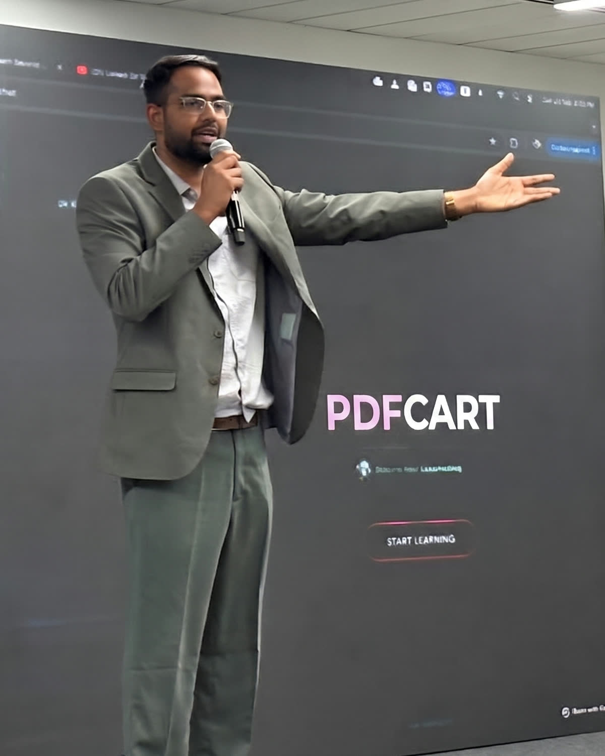 Lokesh Bhardwaj, founder of PDFCart, presenting PDFCart on stage at a technology conference